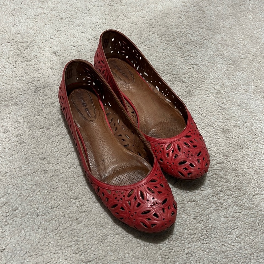 Red leather flats.